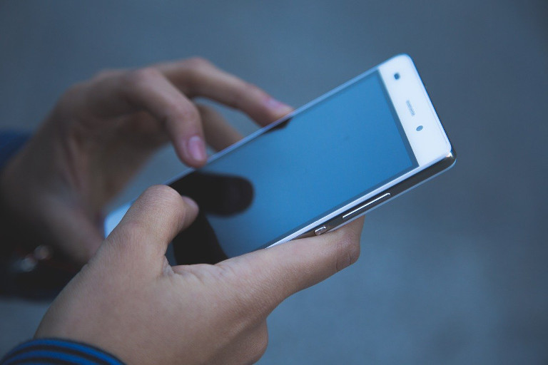 hands on smartphone