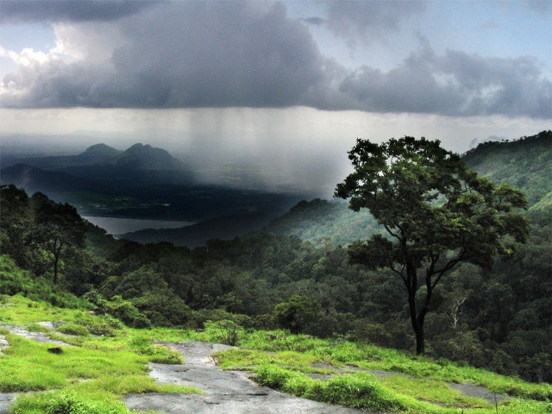Picturesque landscape of hills, lake, mountains.