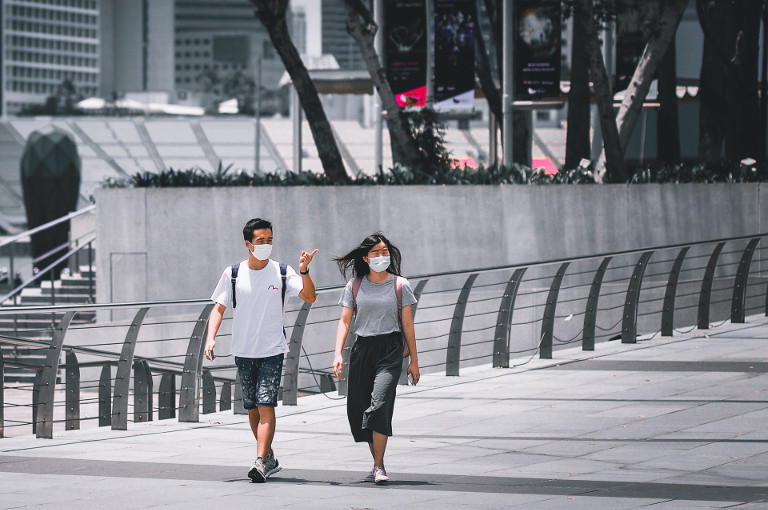 2 people with masks