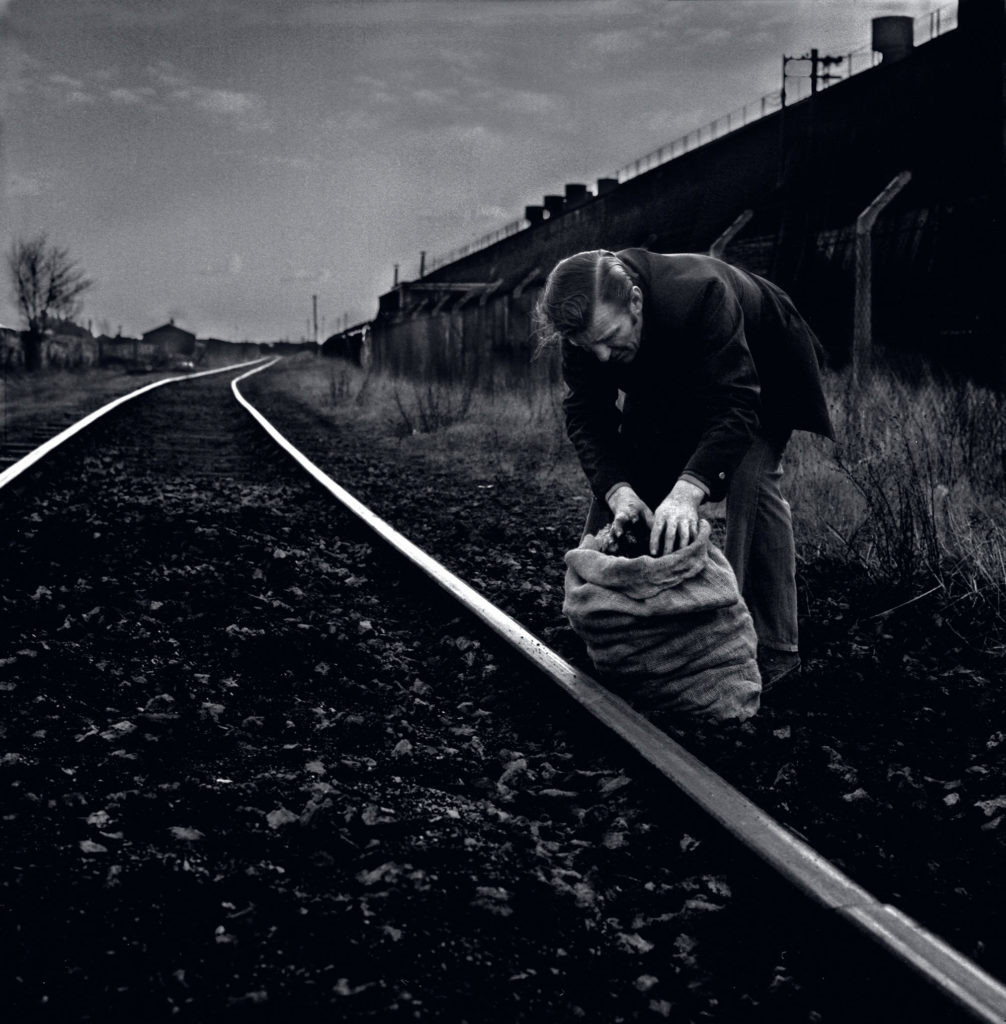 Man picking coal