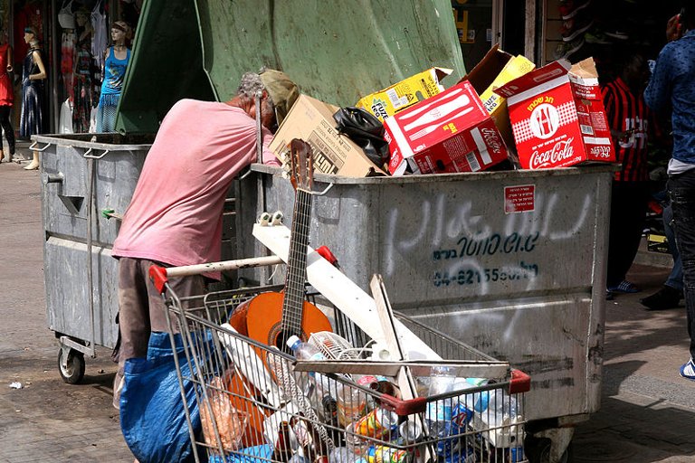 Homeless man seaching for some treasures (2015, Israel)